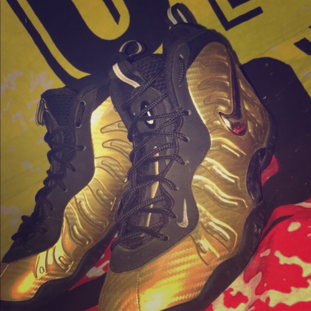 Gold and black Nike Foam Posits